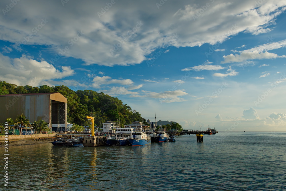 Sandakan. Malaysia. 11/26/2018. Berth marine fish market. Fishing boats and boats rest after unloading the catch of fish for sale. Sandakan. Malaysia. 11/26/2018. Berth marine fish market. Fishing boats and boats rest after unloading the catch of fish for sale.