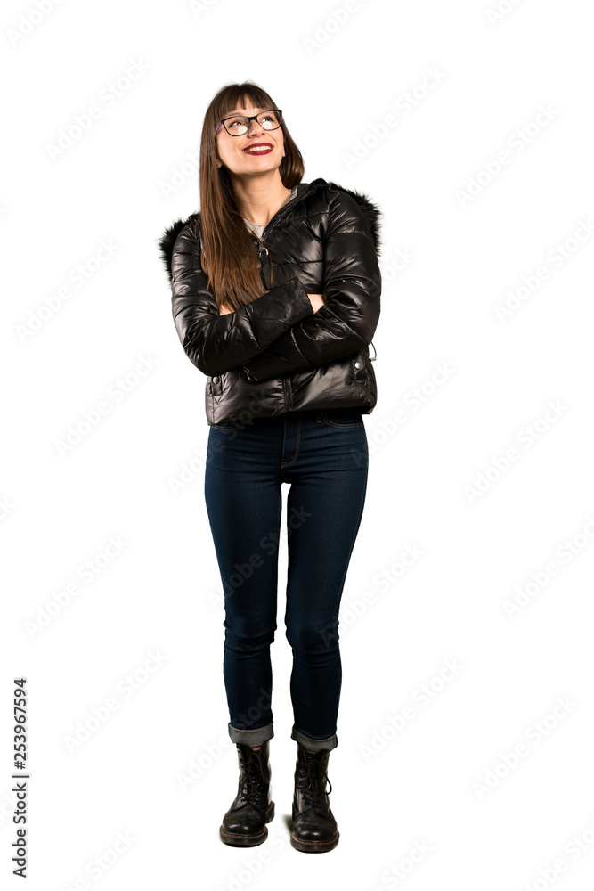 Full-length shot of Woman with glasses looking up while smiling Full-length shot of Woman with glasses looking up while smiling