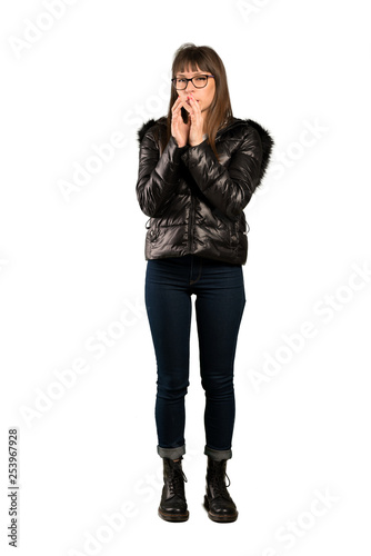 Full-length shot of Woman with glasses scheming something