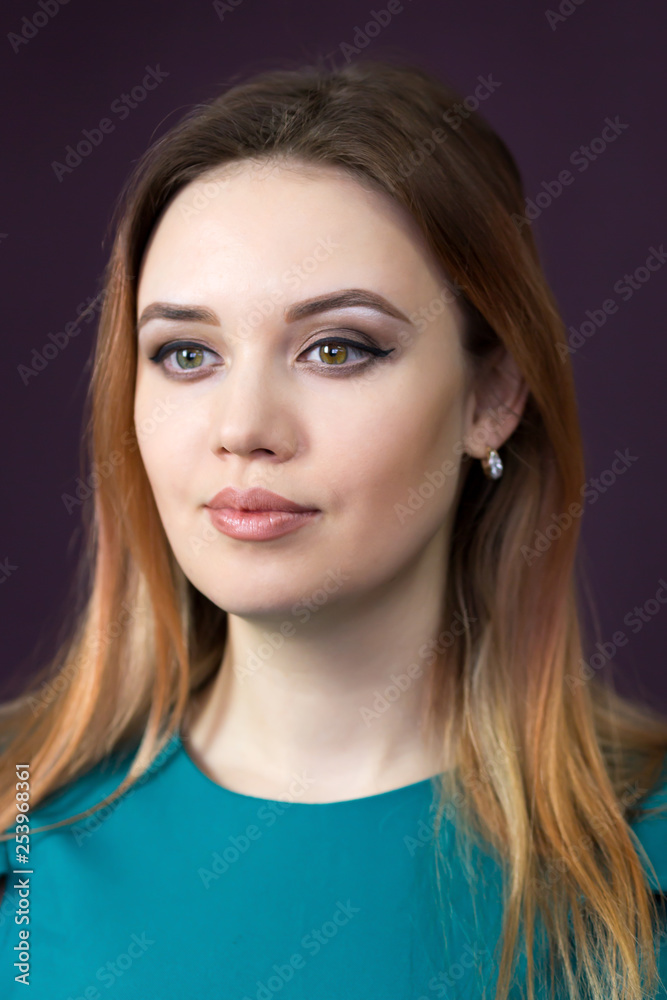 Close-up portrait of a beautiful caucasian girl. Woman 25-30 years old close up in a green dress. Close-up portrait of a beautiful caucasian girl. Woman 25-30 years old close up in a green dress.