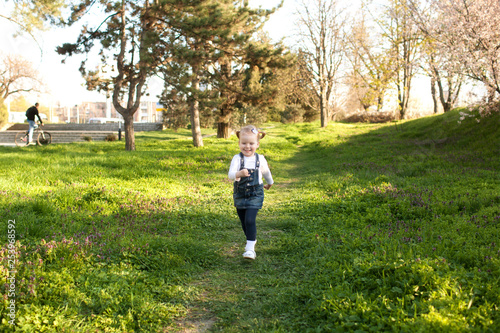little girl running in the park