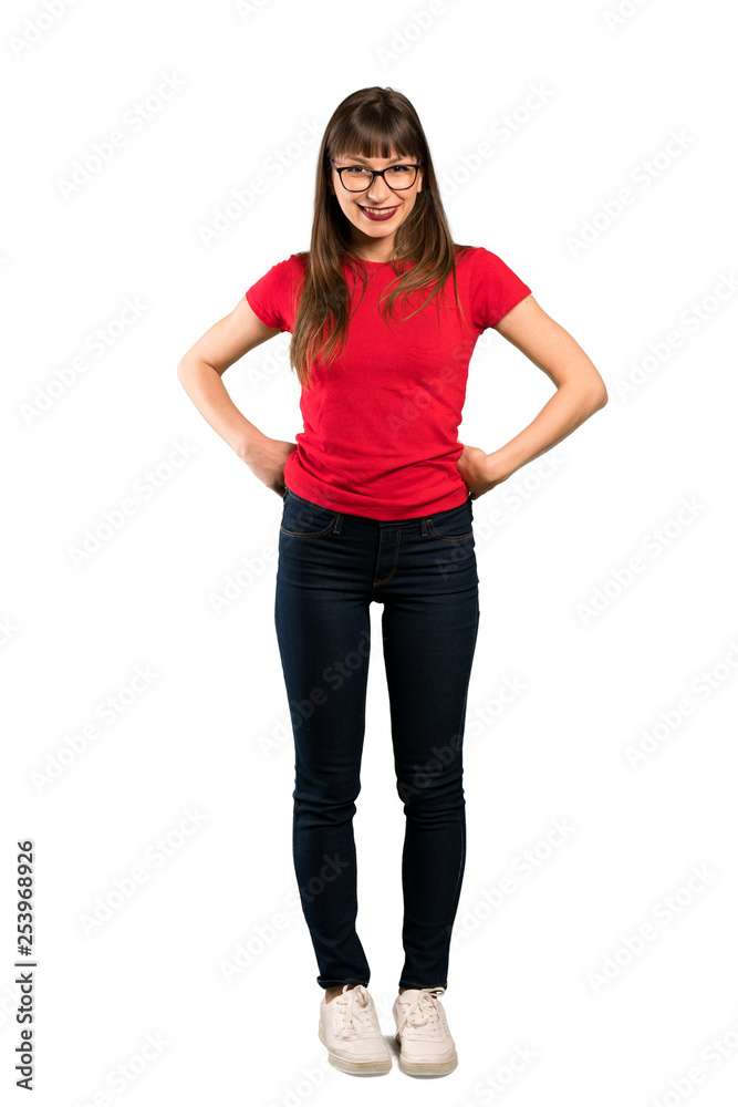 Full-length shot of Woman with glasses posing with arms at hip and smiling Full-length shot of Woman with glasses posing with arms at hip and smiling