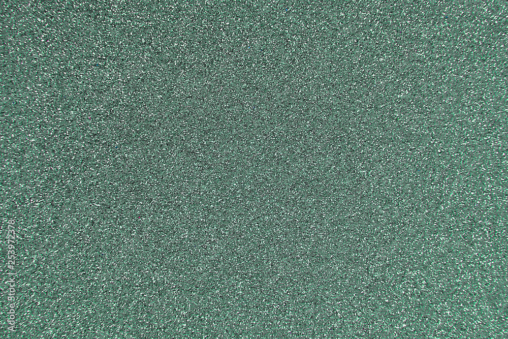 Fototapeta premium Texture of wrapping paper from shiny glitter. Defocus, abstract background.