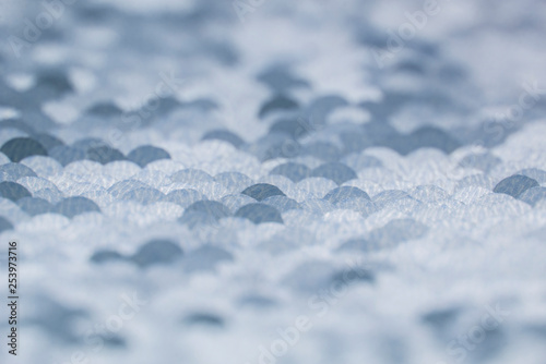 Texture fabric with shiny round sequins. Abstract background  defocus.