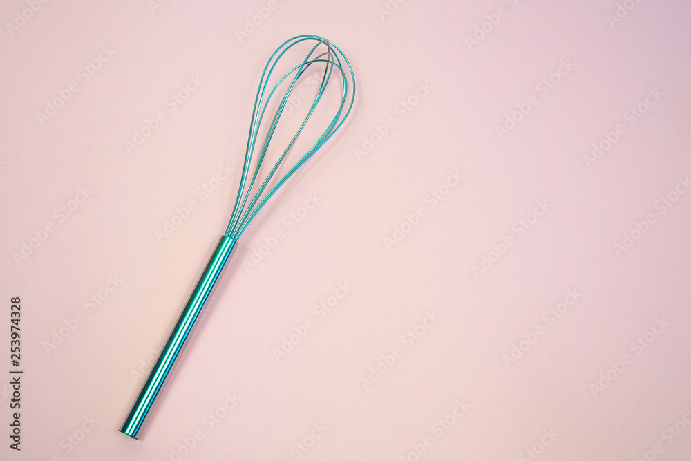 whisk on pink pastel background. Top view, minimalism whisk on pink pastel background. Top view, minimalism