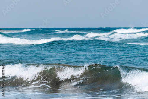 Windy weather. Waves on the sea. Sea coast. Skyline. Sunny day. Mediterranean Sea at winter season