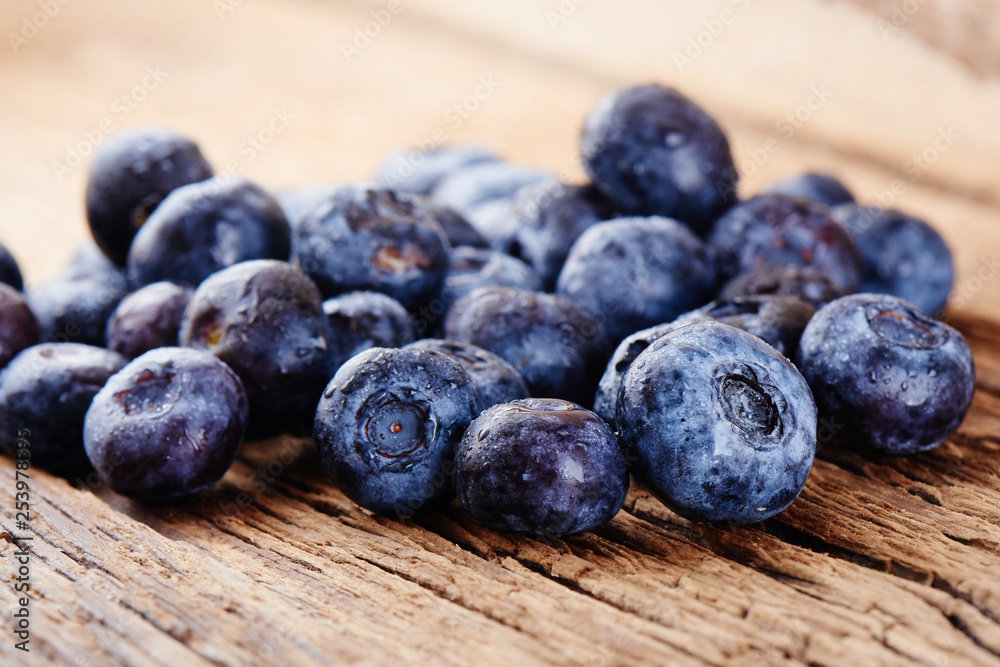 Fresh raw blueberries on wooden background close up Fresh raw blueberries on wooden background close up