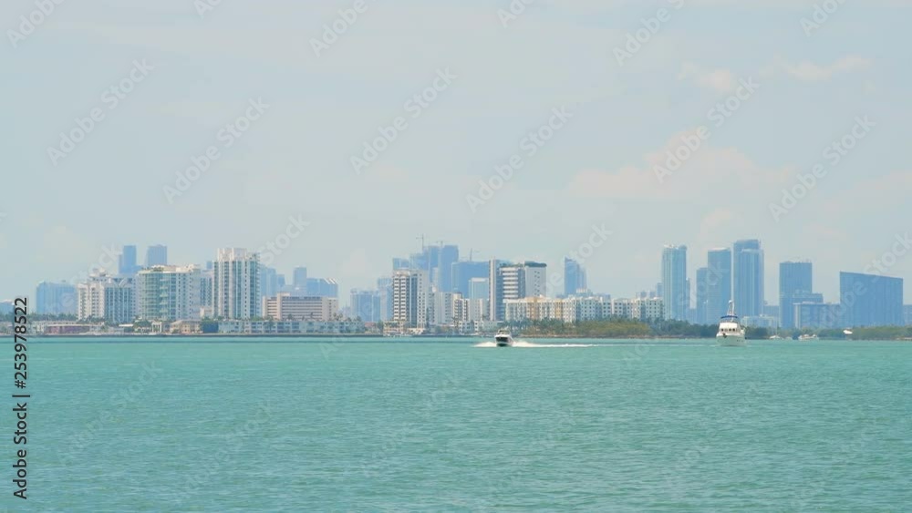 Miami Florida with Biscayne Intracoastal water during day and closeup view of downtown cityscape skyscrapers and North Bay Village Miami Florida with Biscayne Intracoastal water during day and closeup view of downtown cityscape skyscrapers and North Bay Village