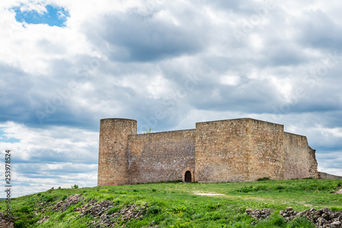 Castle of Medinaceli against a cloudy sky photo