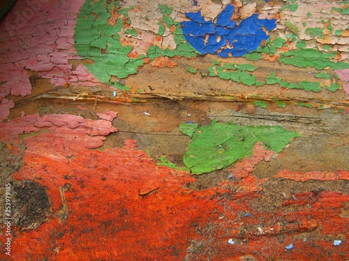 peeled wood surface painted in different colors