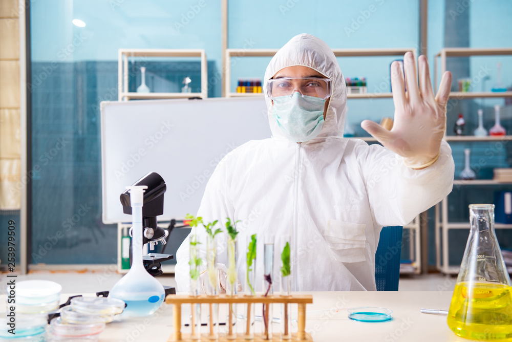 Male biotechnology scientist chemist working in the lab Male biotechnology scientist chemist working in the lab