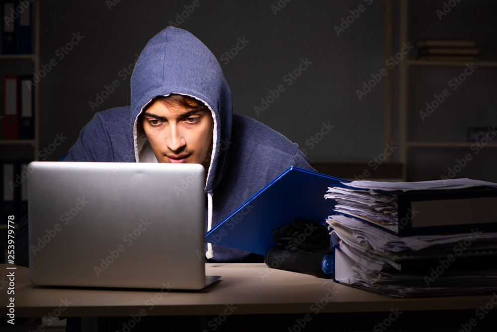 Thief trying to steal personal data in identity theft concept