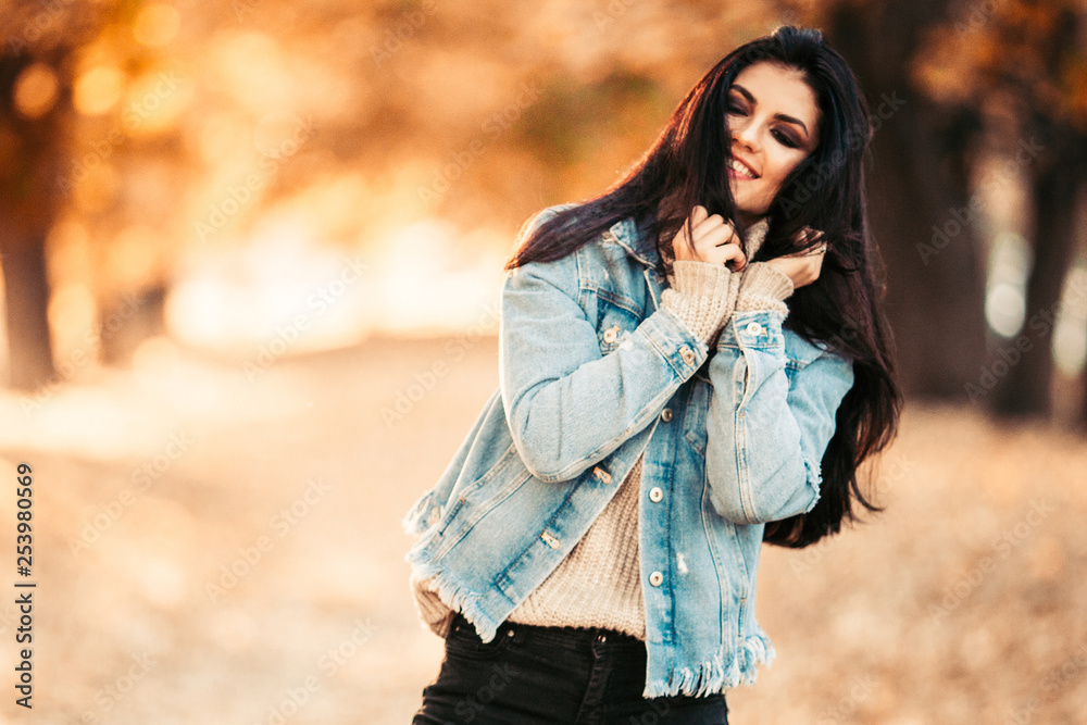 Beautiful model posing for the camera in the park. Beautiful model posing for the camera in the park.