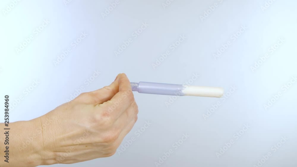Close up demonstration of how a tampon works Close up demonstration of how a tampon works