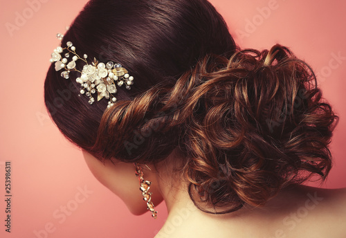   young woman with beautiful hairstyle and stylish hair accessory