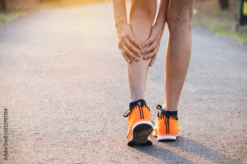 Woman walking on the road get accident on her legs the image is for health concept.