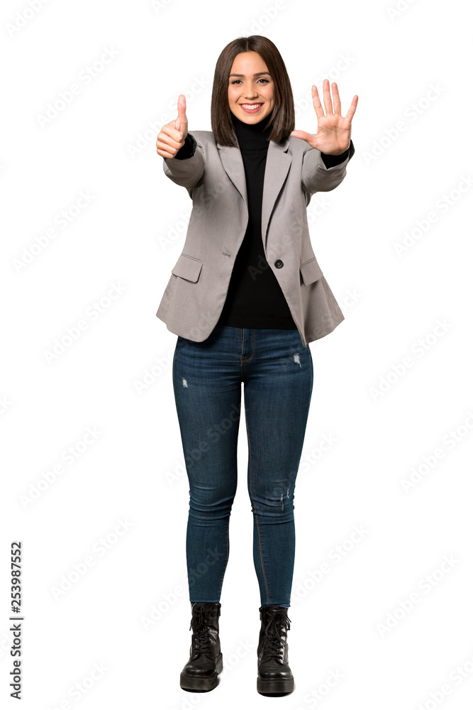 A full-length shot of a Young business woman counting six with fingers over isolated white background