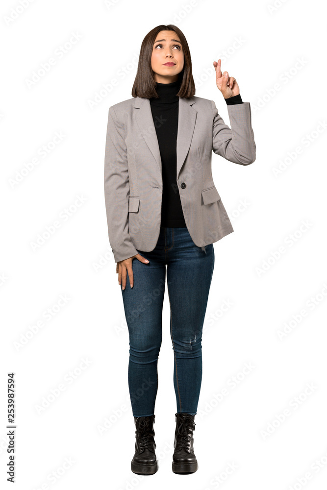 A full-length shot of a Young business woman with fingers crossing and wishing the best over isolated white background A full-length shot of a Young business woman with fingers crossing and wishing the best over isolated white background