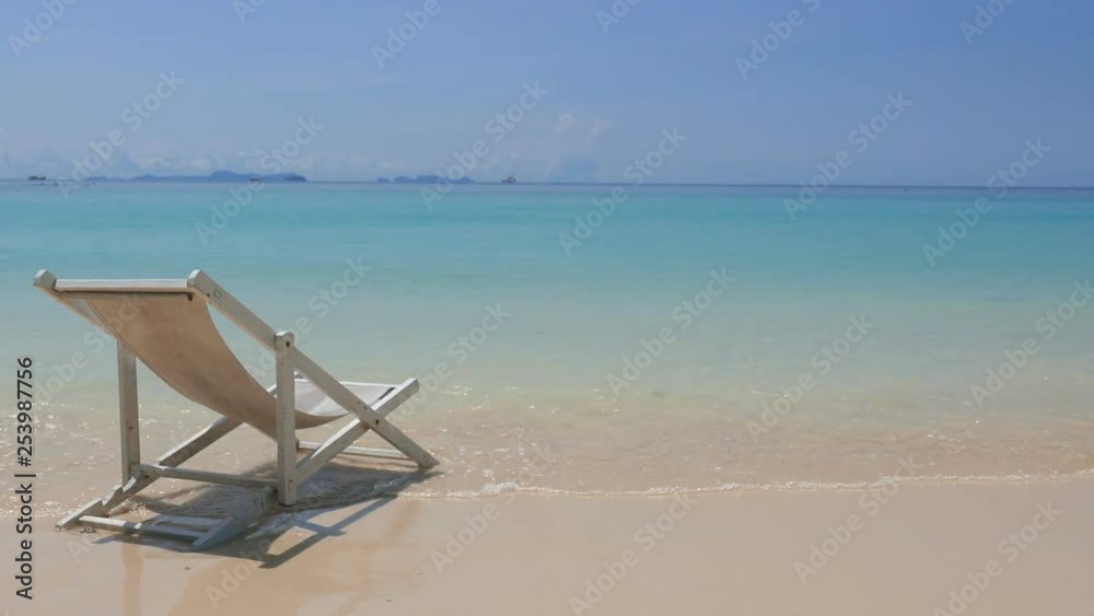 inviting beach chair on an isolated beach inviting beach chair on an isolated beach