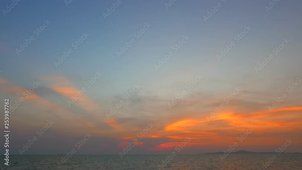 A vibrant sunset over a calm, tropical sea at twilight. Lots of copy space. A vibrant sunset over a calm, tropical sea at twilight. Lots of copy space.