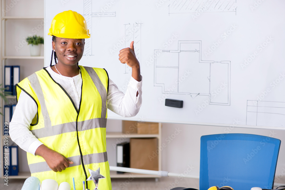 Young black architect working on project Young black architect working on project