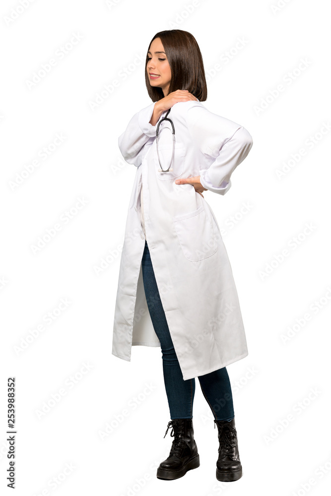 A full-length shot of a Young doctor woman suffering from pain in shoulder for having made an effort over isolated white background A full-length shot of a Young doctor woman suffering from pain in shoulder for having made an effort over isolated white background
