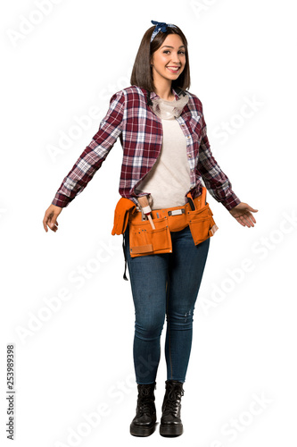 A full-length shot of a Young worker woman smiling over isolated white background