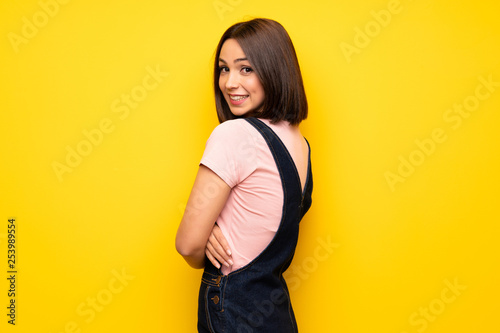 Portrait of young woman over white wall