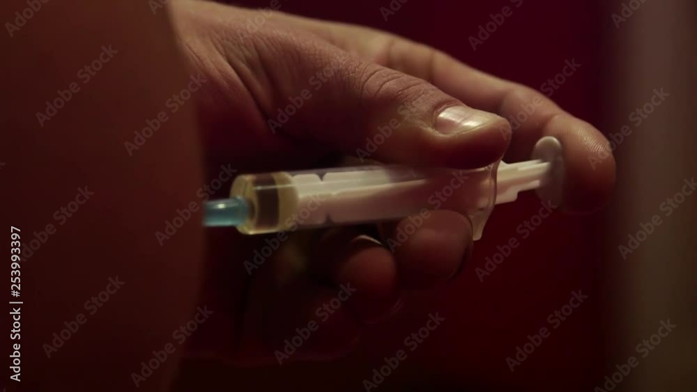 Close up of a bodybuilder getting a anabolic steroid injection Close up of a bodybuilder getting a anabolic steroid injection