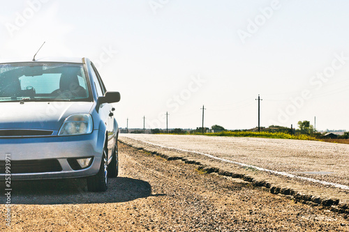 car parked on the side of the road. Travelers by car stopped for rest