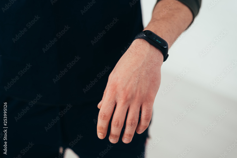 Man with smart device fitness bracelet large