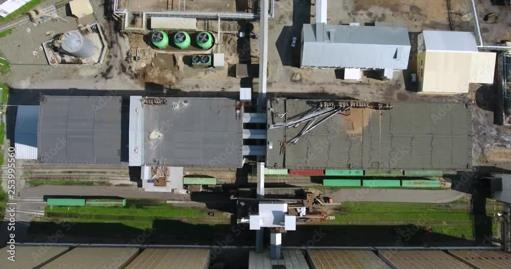 Aerial view of a Industrial Manufacturing Plant, with three large rotating turbines, Europe Aerial view of a Industrial Manufacturing Plant, with three large rotating turbines, Europe