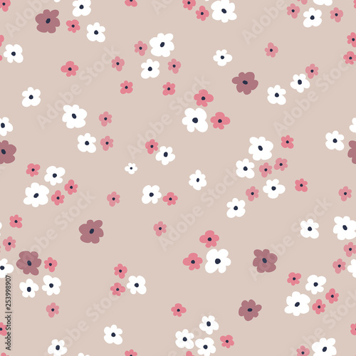 Seamless pattern background with simple hand drawn flowers. Seamless ditsy floral pattern for baby and women products,fabric,textile,wrapping paper, stationery,web design.