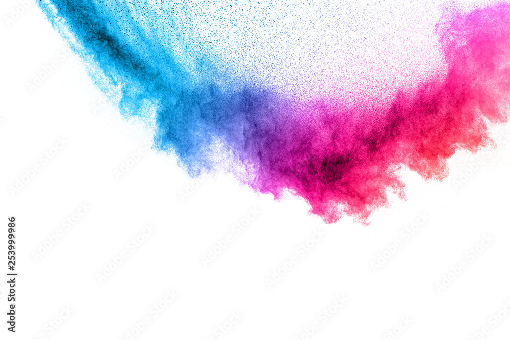 Multi colour powder explosion on white background. Launched colourful dust particles splashing.