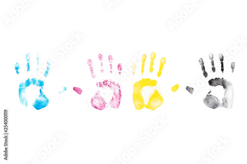 CMYK Color hand prints on white background. Cyan, Magenta, Yellow, Black laser printer toner.