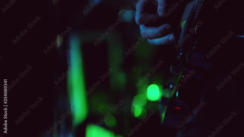 Active men performing at popular concert on blurred dark green background Active men performing at popular concert on blurred dark green background