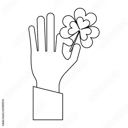 hand hoding clover shamrock symbol in black and white