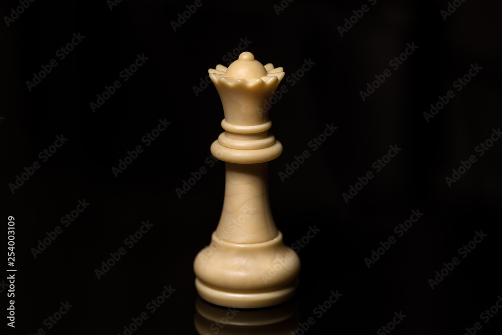 Classic Chess White Queen on black board, isolated Classic Chess White Queen on black board, isolated