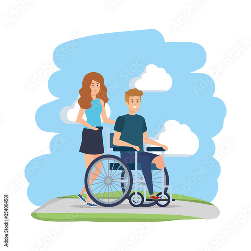 young man in wheelchair with female helper