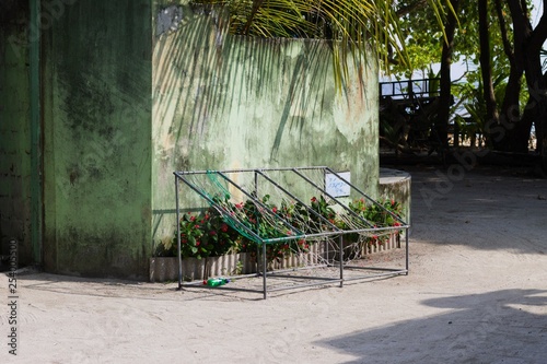 Ari Atoll, Maldives - December 24 2019: Typical maldivian seats in front of the house with palm trees
