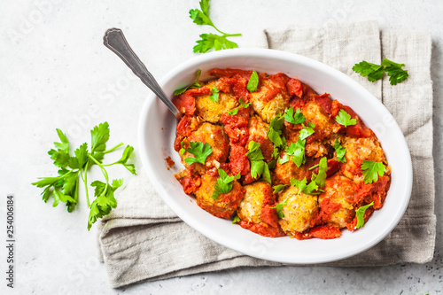 Baked vegan bean meatballs in tomato sauce. photo