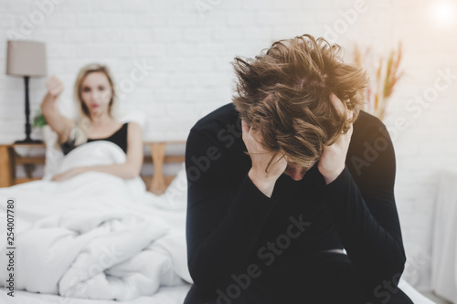 Handsome man disappointed himself that his wife get disappointed him because he get premature evacuation. Man get shy and failure. Guy get sadness, unhappy and lost confidence with unsatisfied woman photo