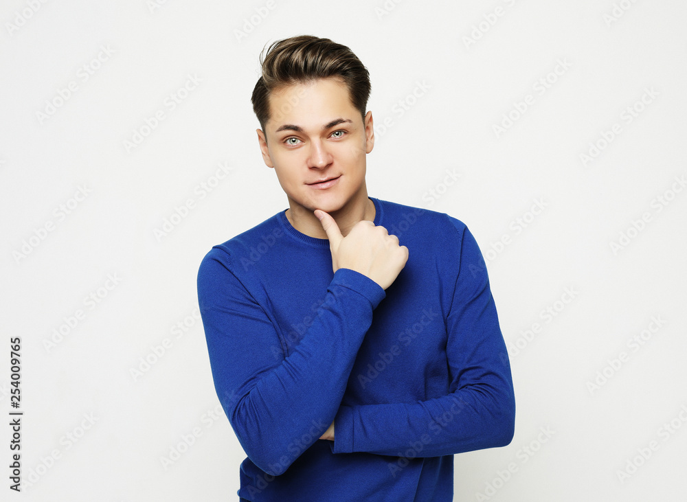 Attractive Young Male Model posing in studio Attractive Young Male Model posing in studio
