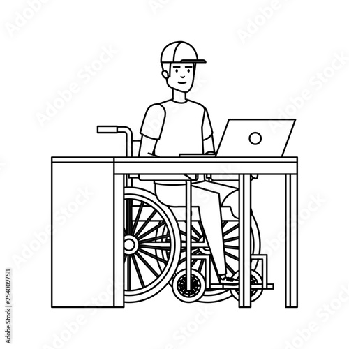 young man in wheelchair working in the office