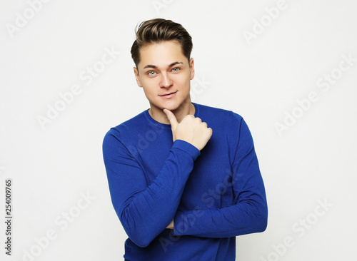 Attractive Young Male Model posing in studio