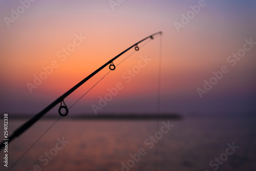 Morning fishing rode water shore sunrise no sun diagonal