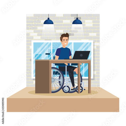 young man in wheelchair working in the office