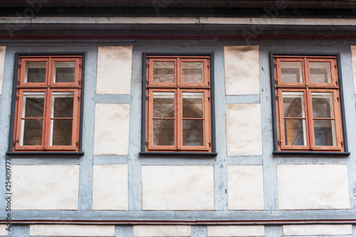 three windows in a half-timbered house with reflection in Germany, Fachwerkhaus