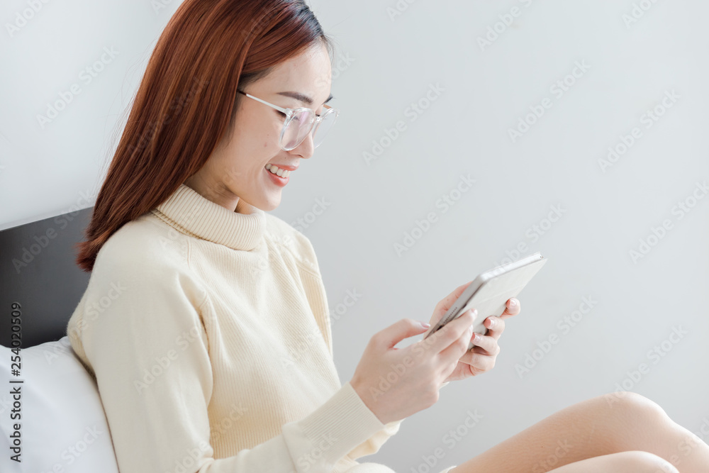 Attractive business woman use computer tablet to see her online store Attractive business woman use computer tablet to see her online store