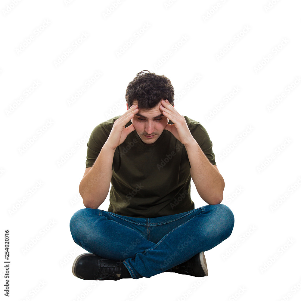 Fotografie upset man sitting on the floor